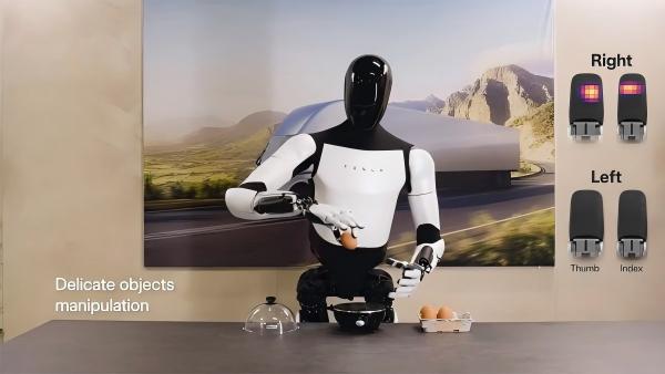 Tesla Optimus Gen 3 humanoid robot demonstrating tactile sensitivity by holding an egg